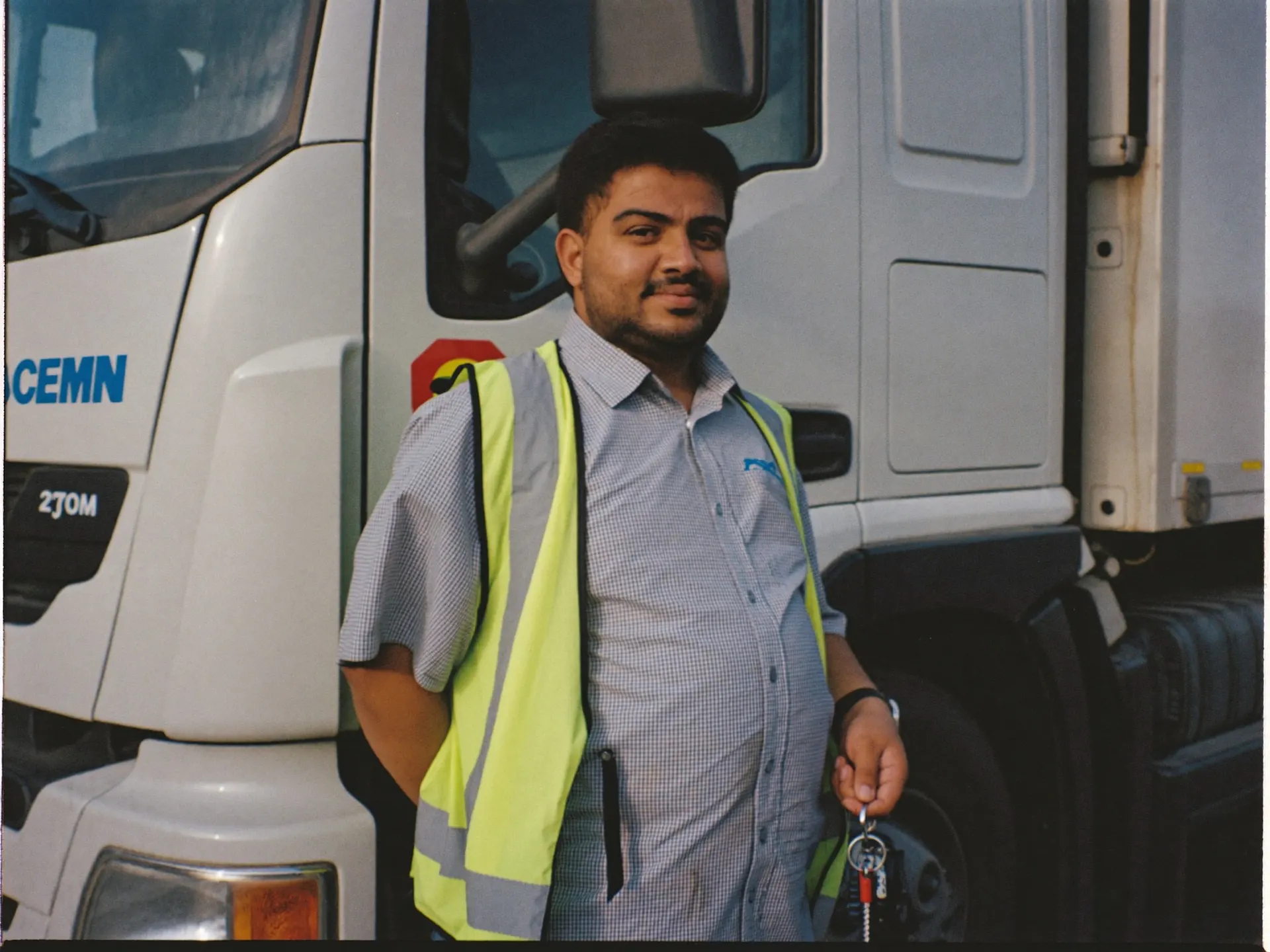 An Indian truck driver at the wheel of a heavy goods vehicle